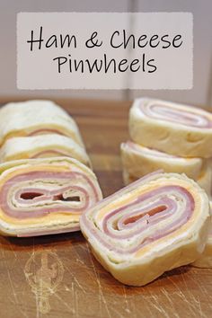 ham and cheese pinwheels cut in half on a cutting board with text overlay