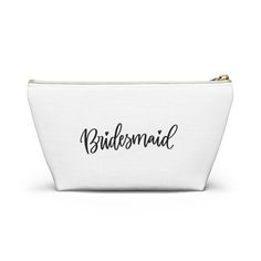 a white cosmetic bag with the word bridesmad printed on it's side