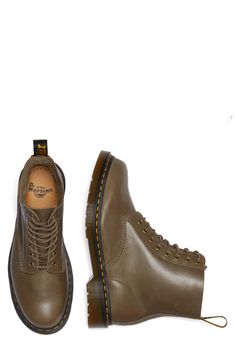 Show off signature style in this monochromatic leather combat boot constructed with an AirWair-cushioned footbed and iconic lugged sole. 1/2" heel; 1" platform Leather upper and lining/synthetic sole Imported Fall Streetwear Work Boots With Vibram Sole, Leather Footbed Combat Boots With Round Toe For Streetwear, Leather Footbed Combat Boots For Streetwear, Casual Steel Toe Lace-up Boots For Streetwear, Classic Ankle Combat Boots For Streetwear, Fall Streetwear Boots With Cushioned Footbed, Casual Combat Boots With Reinforced Toe For Streetwear, Classic Combat Boots For Streetwear In Fall, Classic Combat Boots For Fall Streetwear