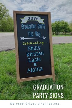 a graduation party sign sitting in the grass