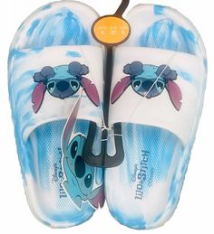 Brand: Disney US Shoe Size: 6 Style: Slide Color: Blue, White Department: Women Upper Material: Synthetic Rubber Type: Sandal Features: Comfortable Molded Footbed Closure: Slip On Character: Stitch Pattern: Tie-Dye Occasion: Casual New with Tag Slide Slippers, Disney Lilo, Synthetic Rubber, Blue Tie Dye, Blue Ties, Lilo And Stitch, Womens Slippers, Stitch Patterns, Tie Dye