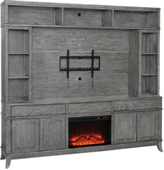 a large entertainment center with a fire place