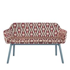 a red and white patterned couch sitting on top of a wooden frame