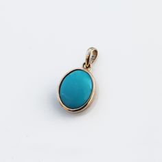 > Material - 14K Solid Yellow Gold > Gemstone - Turquoise > Stone weight - 6.460 ct > Number of stone - 1 piece Turquoise is perhaps the oldest stone in man's history, the talisman of kings, shamans, and warriors. It is a stone of protection, strong and opaque, yet soothing to the touch, healing to the eye, as if carved from an azure heaven and slipped to earth. Its unique shade of blue, often blue-green, lends it name, Turquoise, to all things of this tranquil hue. The delicate vein Turquoise 14k Gold Round Pendant Jewelry, 14k Gold Turquoise Pendant Jewelry, Yellow Gold Oval Turquoise Necklace Gift, Oval Turquoise Necklace In Yellow Gold As Gift, Oval Yellow Gold Turquoise Necklace As Gift, 14k Gold Turquoise Necklace For Gift, Minimalist Gold Necklace, December Birthstone Necklace, Minimalist Necklace Gold