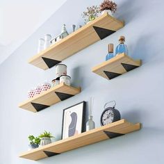 three wooden shelves with various items on them