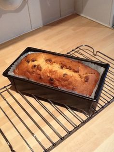 a loaf of bread sitting on top of a cooling rack