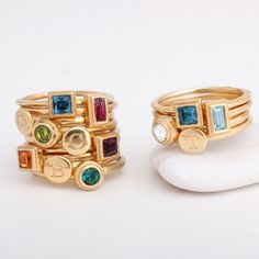 "Always wanted to be a jewelry designer? Now you can be with our DIY stackable rings. You can combine any number of initial, symbol and birthstone rings you want to create a stylish and meaningful piece of jewelry. Create a family ring with one initial and one birthstone for each member of your family! **Note: The price listed is for a set of two rings, one initial ring and one birthstone ring in 24K gold vermeil. Make the selection of which combination you want below and the price will change a Modern Stackable Initial Ring For Anniversary, Modern Personalized Stackable Rings, Personalized Modern Stackable Rings, Modern Gold Stackable Birthstone Rings, Modern Gold Stackable Rings With Birthstones, Modern Bezel-set Birthstone Ring Gift, Personalized Stackable Rings With May Birthstone, Modern Stackable Round Birthstone Ring, Gold Rings With Bezel Setting For Birthday