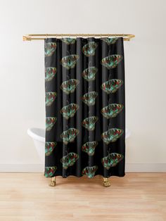 a colorful butterfly shower curtain hanging on a wall