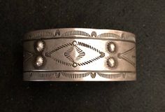 Early stamped silver bracelet. Purchased from Lynn Trusdell's Collection. This bracelet is absolutely beautiful with excellent detailed stamping. It is also in outstanding condition!  This is an exceptional piece and would be a great addition to any collection. This bracelet fits a 7" wrist and has a 1 1/4" opening. Weight: 32.7 grams. I used different backgrounds and lighting for your viewing. Free Insured Shipping between now and Christmas! Estate Style Silver Jewelry Gift, Estate Style Silver Jewelry For Gifts, Vintage Hallmarked Sterling Silver Bracelet, Antique Sterling Silver Round Bracelet Collectible, Collectible Sterling Silver Antique Bracelet, Hallmarked Vintage Sterling Silver Bracelet, Antique Round Sterling Silver Collectible Bracelet, Antique Hallmarked Sterling Silver Bracelet, Vintage Sterling Silver Bracelet For Formal Occasions