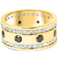 a gold ring with black and white diamonds