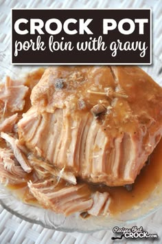 crock pot pork with gravy on a glass plate