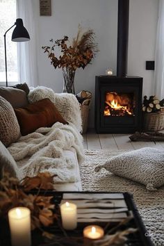 a living room filled with furniture and a fire place