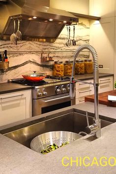 a kitchen with stainless steel appliances and marble counter tops is pictured in this image from chicago, illinois