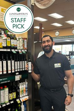 a man standing in front of a store display