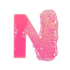 the letter n is made up of bubbles and pink liquid on a white background,