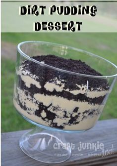 dirt pudding dessert in a glass bowl on a wooden table with the words dirt pudding desert above it