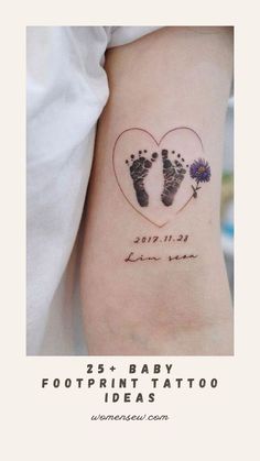 a baby footprints tattoo on the back of a woman's arm with flowers in it