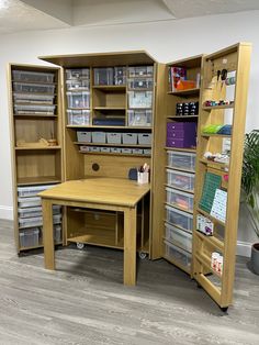 an open bookcase with several drawers and shelves