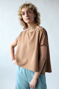 Oversize modal blouse. Cropped front, loose sleeves.   - Oversize fit style blouse  - Round neckline - Short loose kimono style sleeves - Handmade by our family Oversized Short Sleeve Brown Blouse, Oversized Brown Blouse With Short Sleeves, Oversized Brown Blouse For Summer, Brown Oversized Short Sleeve Blouse, Oversized Brown Summer Tops, Effortless Relaxed Fit Viscose Top, Oversized Rayon Summer Blouse, Versatile Cropped Tops With Relaxed Fit, Versatile Flowy Short Sleeve Tops