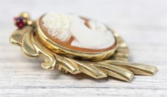 "HERE ARE THE DETAILS YOU NEED Antique 14K White Gold Carved Shell Cameo Brooch Filigree Pendant Pearl Luxury N5976 BEAUTIFUL LADY W/ FLOWERS. HAND CARVED SHELL. FINEST DETAIL AMAZING BROOCH PIN WONDERFUL HIGHEST QUALITY. JUST PART OF MY MOST RECENT ESTATE FINDS! FOLLOW ME TO SEE THEM ALL! Metal Purity: Metal: 14K White Gold Material: Carved Shell Cameo Form: Brooch Filigree Pendant Pearl Luxury Size :1 1/2 x 1 1/4\" Age: Antique Weight (Grams): 6.2 IT IS IN VERY FINE ESTATE CONDITION ALL ITEMS Elegant Gold Intaglio Brooches, Classic Gold Brooch With Intaglio Detail, Classic Gold Intaglio Brooch, Classic Gold Intaglio Brooches, Classic Gold Brooches With Intaglio, Vintage Italy, Carved Shell, Filigree Pendant, Cameo Brooch