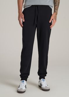 Relax In Style The Ultimate Extra-Long Men's Joggers Ready to meet your new favorite joggers? Our Wearever 2.0 Fleece Tall Men's Joggers are here to revolutionize your chill time. Designed for men over 6', these aren't just any joggers—they're your go-to for year-round comfort. Made from cozy fleece with a stretch fabric that moves with you, they offer a modern fit that's just right, not too tight. The updated trim, stylish drawstring, and thoughtful branding elevate these from basic to essentia Black Athleisure Sweats With Comfort Waistband, Black Joggers With Ribbed Waistband For Jogging, Black Joggers With Ribbed Waistband, Black Tapered Leg Sweatpants For Gym, Black Athleisure Joggers With Comfort Waistband, Black Sports Joggers With Ribbed Cuffs, Black Joggers With Comfort Waistband For Jogging, Black Moisture-wicking Joggers For Loungewear, Black Sweatpants With Ribbed Cuffs For Gym