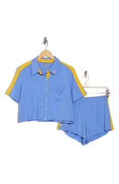 Drift off in this comfy pajama set including a boxy, cropped button-up shirt and coordinating shorts cut from supersoft jersey. Top has front button closure; spread collar; short sleeves Bottoms have elastic waist 95% viscose, 5% elastane Machine wash, tumble dry Imported Blue Relaxed Fit Sleep Sets, Blue Short Sleeve Matching Sleepwear Set, Blue Short Sleeve Sleepwear, Playful Blue Cotton Pajama Shorts, Cropped Button Up Shirt, Blue Sleepwear With Elastic Waistband, Short Length, Pajama Shorts, Classic Blue, Alice Olivia