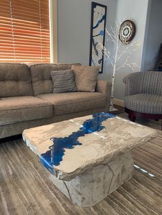 a living room with couches and a coffee table in the middle of the room