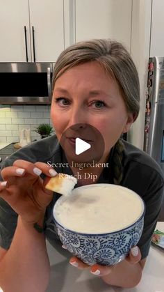 a woman holding a bowl of food in her hand and making a funny face with the caption secret ingredient french dip