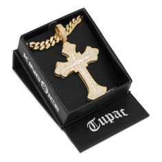 Many stones surround the inner cross composed of princess-cut stones and matched with an iced bale. Tupac Cross, 2pac Tattoos, Boondocks Drawings, Chrysler Newport, Tupac, Princess Cut, Cross Pendant, Cross Necklace, White Gold