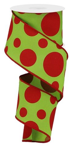 a roll of green and red polka dot ribbon