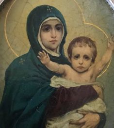 a painting of a woman holding a child in her arms with a cross on it