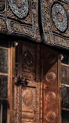 an ornate wooden door with intricate carvings on it