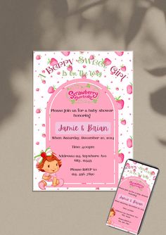 a pink baby shower is on the table next to it's birth announcement card