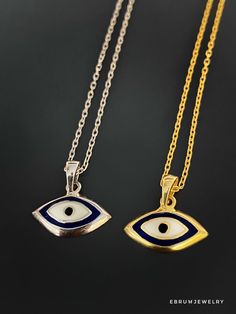 The Dainty Evil Eye Necklace is perfect for you if you're looking for something simple to wear every day. This beautiful necklace features a small evil eye charm on a sterling silver chain and will brighten your day with its protective energy and bring you good luck. This necklace comes in a silver and a 18k gold plated variant. The Dainty Evil Eye Necklace also has a matching bracelet and earrings. The Evil Eye bead is a prominent symbol in Turkish and many other cultures, and is highly protect Symbolic Pendant Necklace With Silver Chain, Symbolic Silver Pendant Necklace, Sterling Silver Pendant Chain Necklace With Charms, Symbolic Sterling Silver Necklace With Adjustable Chain, Silver Charm Necklace With Delicate Chain For Good Luck, Symbolic Evil Eye Round Pendant Necklace, Sterling Silver Symbolic Pendant Necklace, Symbolic Sterling Silver Charm Necklace With Adjustable Chain, Silver Jewelry With Delicate Chain For Good Luck