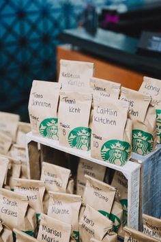 there are many bags of starbucks coffee on display