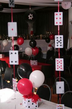 a casino themed party with balloons and cards