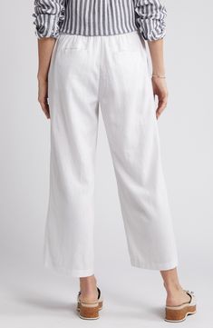 These lightweight linen pants are cut with cropped wide legs and topped with a comfortable elastic-drawstring waist. 25" inseam; 25" leg opening; 11" front rise; 15 1/2" back rise (size Medium) Elastic/drawstring waist Front slant pockets; back patch pockets 100% linen Machine wash, tumble dry Imported Spring Linen Wide Leg Pants With Pull-on Style, White Relaxed Wide Leg Pants With Elastic Waistband, Casual Solid Color Linen Capris, White Linen Wide Leg Casual Pants, Casual White Linen Wide Leg Pants, Casual Wide Leg Linen Capris, White Linen Wide Leg Pants With Elastic Waistband, Spring Linen Wide Leg Capris, Casual Wide-leg Linen Capris