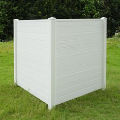 a large white plastic storage box in the grass