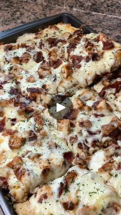 a pizza sitting on top of a pan covered in cheese and toppings with one slice missing