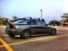 a silver car parked in a parking lot