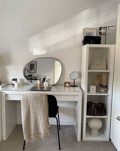 a white desk with a mirror and some lights