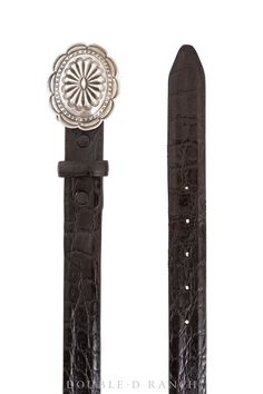 a pair of black alligator skin belts with silver buckles and an embellishment