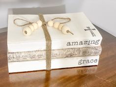 a gift box wrapped in twine and string with the words amazing grace written on it