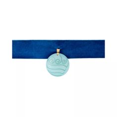 a blue ribbon with a round pendant on it's end, hanging from the side