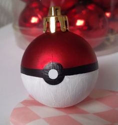 a red and white ornament sitting on top of a table