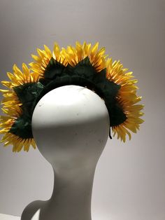 Sunflower Flower Fascinator- Yellow Headband- Mad Hatter Party- Tea Party- Kentucky Derby- Wedding Garden Party Hello, This headpiece is made with 6 sunflower that are about 5 inches wide. Flowers are tilted for extra height. Perfect for fall and anyone who loves sunflowers. It is attached to a black covered skinny headband and is adjustable. Leaves finish off the back. It's very comfortable and will fit any size head. 10 to 90! I've been making hair pieces over 20 years. I love what I do and I Adjustable Costume Accessories For Summer Festival, Whimsical Flower Costume Hats For Party, Whimsical Summer Headband With Handmade Flowers, Whimsical Summer Headpiece With Handmade Flowers, Floral Headpieces For Summer Garden Parties, Summer Party Flower Headband, Adjustable Flower Shaped Fascinator For Garden Party, Summer Party Flower Hair Accessories, Adjustable Flower Headband For Summer