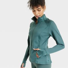 Why we’re ALL IN: This jacket features soft curves that contour to the shape of your body to move with you as you stretch and flow. A full-length zipper offers as much coverage as you like, and it's concealed by a zipper garage for comfortable wear. Thumbholes keep the sleeves in place and keep your hands warm, and the stretchy knit fabric lends a soft, smooth feel for year-round wear. Secure side-entry pockets provide safe storage and maintain a sleek shape when closed. All in Motion™: Made for Fitted Solid Outerwear With Thumbholes, Fall Outerwear With High Stretch And Moisture-wicking, Functional Fall Activewear With Zipper Closure, Fitted Track Jacket With Zipper For Sports, Fitted Solid Track Jacket With Moisture-wicking, Fall High Stretch Moisture-wicking Outerwear, Moisture-wicking High Stretch Fall Outerwear, Functional Green Stretch Outerwear, Fitted Solid Color Moisture-wicking Outerwear