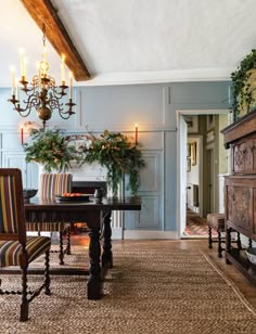 a living room filled with furniture and a chandelier