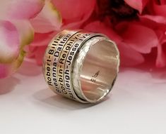 "Free first class shipping on all items with standard gift box! Free priority shipping on orders over $140 with upgraded gift box! U.S. shipments only Want something so unique that others will have no choice, but to ask what ring you are wearing? These are sure to do just that while still offering the personalization of the names of your loved ones right on each ring. With over 600 spinners made, you can rest assured these rings have a superior quality with tried and tested engineered design tha Spinning Ring, Rings Etsy, Family Rings, Spinning Rings, Mother Rings, Fidget Rings, Personalized Ring, Meditation Rings, Sterling Jewelry