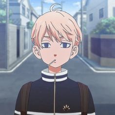 an anime character with blonde hair standing on the street in front of some buildings and looking at the camera